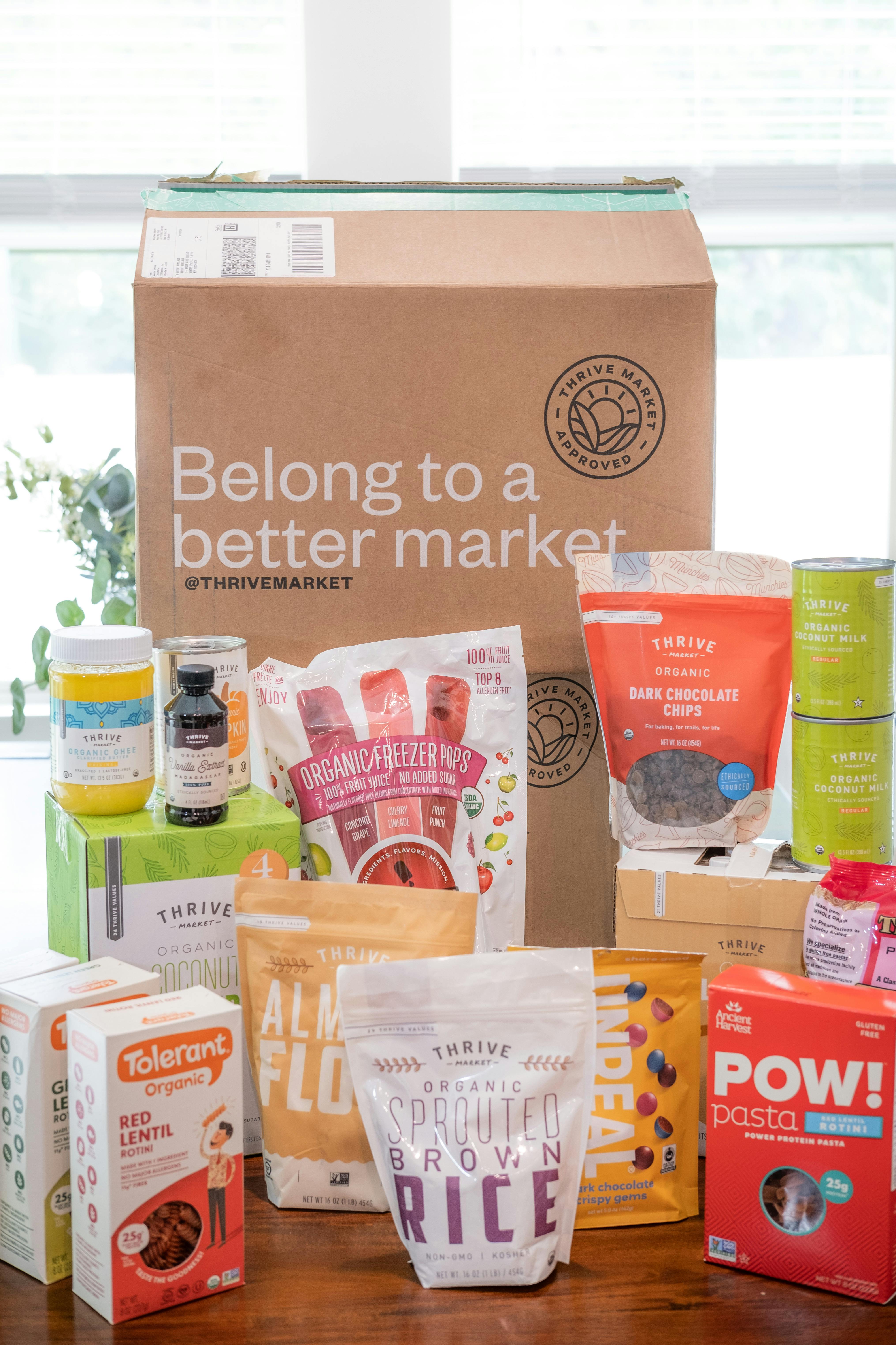 Assorted Thrive Market organic food products in packaging, indoors display.